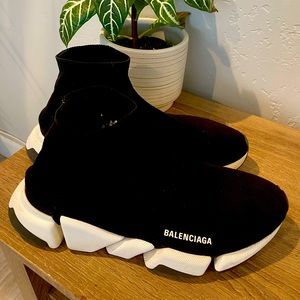 Used—Size 11 Mens, small hole on side ankle (see photo)